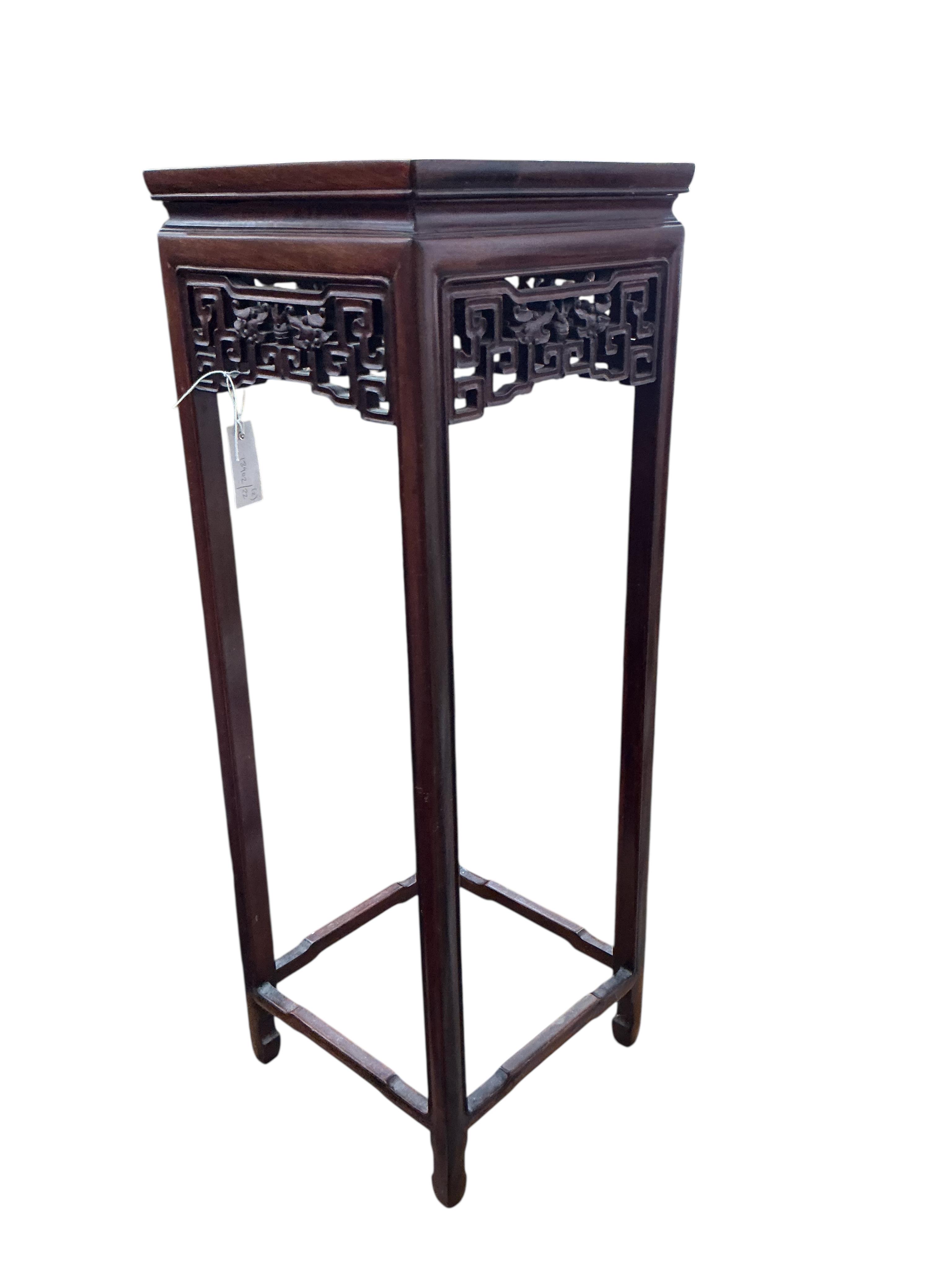A Chinese carved hardwood vase stand, height 92cm together with a mid century two tier table